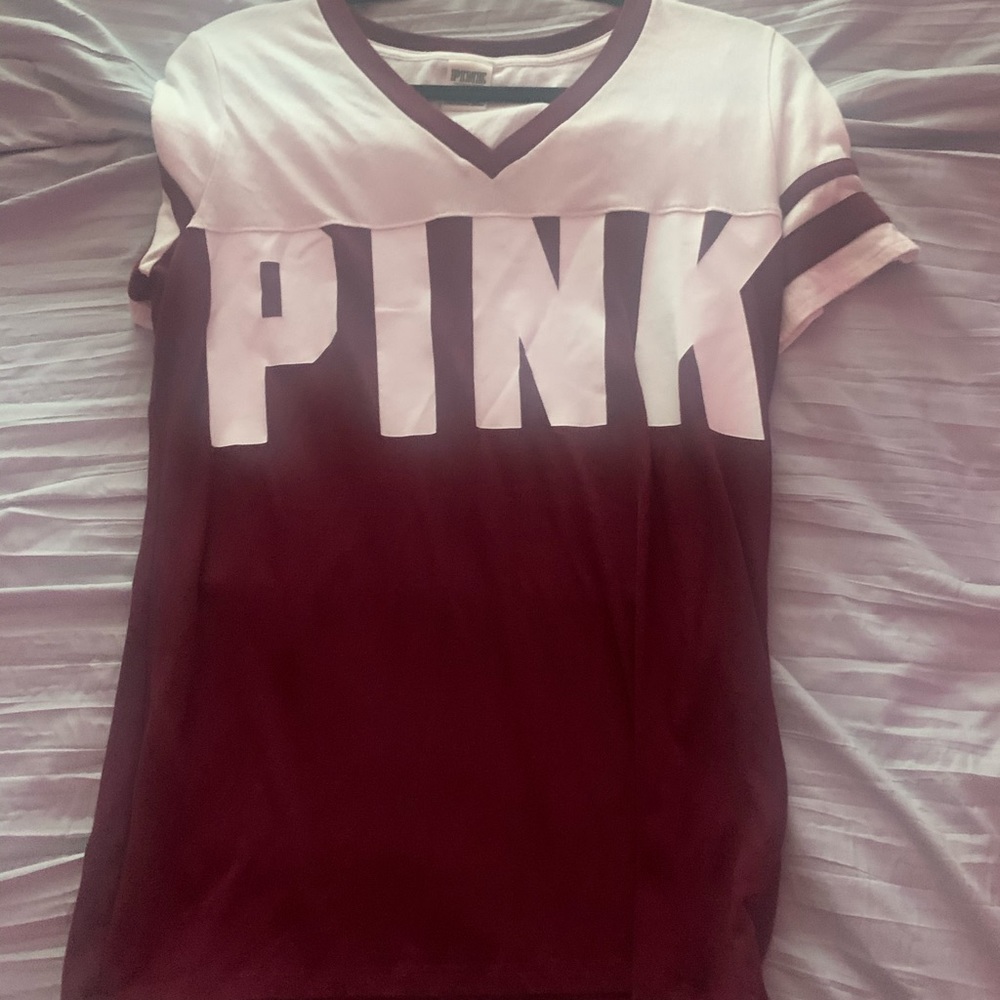 a white and maroon short sleeve